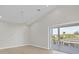Bright bedroom with fan and sliding glass doors leading to the screened lanai and beautiful outdoor view at 1141 Andrews St, Englewood, FL 34224