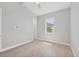 A light-filled bedroom showcasing hardwood floors, a ceiling fan, and natural light at 1141 Andrews St, Englewood, FL 34224