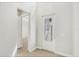 Bright entryway featuring a white front door with glass panes and light wood flooring at 1141 Andrews St, Englewood, FL 34224
