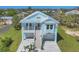 Charming coastal home with a metal roof, double garage, and inviting staircase at 1141 Andrews St, Englewood, FL 34224