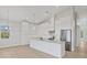 Bright kitchen with large island, modern appliances, and stylish pendant lighting at 1141 Andrews St, Englewood, FL 34224