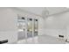 Living area with chandelier and sliding glass doors to screened lanai at 1141 Andrews St, Englewood, FL 34224