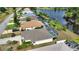 Aerial view features the backyard pool, landscaping, and proximity to the canal at 116 Albatross Rd, Rotonda West, FL 33947