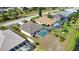 Aerial view showcases the backyard pool, landscaping, and canal-front property at 116 Albatross Rd, Rotonda West, FL 33947