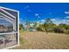 Spacious backyard includes pool, lanai, lush lawn and scenic water view; perfect for outdoor entertaining at 116 Albatross Rd, Rotonda West, FL 33947