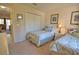 Bedroom featuring two twin beds, a closet, and an ensuite doorway at 116 Albatross Rd, Rotonda West, FL 33947
