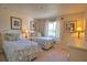 Bright bedroom featuring two twin beds and coordinated tropical decor at 116 Albatross Rd, Rotonda West, FL 33947