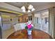Inviting dining area with a wooden table, stylish chairs, and a view of the outdoor patio at 116 Albatross Rd, Rotonda West, FL 33947