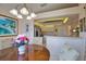 Charming dining area showcasing a wooden table, elegant chairs, and a view of the adjacent kitchen space at 116 Albatross Rd, Rotonda West, FL 33947