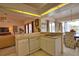 Spacious kitchen with a convenient breakfast bar, seamlessly connecting to the living area for easy entertaining at 116 Albatross Rd, Rotonda West, FL 33947