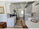 Bright kitchen with white cabinets, stainless steel appliances, and tile floors at 1270 Gulf Blvd # A&B, Englewood, FL 34223