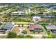 Aerial view of a home and surrounding properties on a canal in a waterfront neighborhood at 14527 Maysville Cir, Port Charlotte, FL 33981