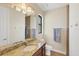 Updated bathroom with granite vanity, ceramic tile flooring and updated fixture at 14527 Maysville Cir, Port Charlotte, FL 33981