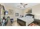 Comfortable bedroom featuring a ceiling fan, and nautical accents at 14527 Maysville Cir, Port Charlotte, FL 33981