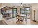 Dining area with a view of the pool and outdoor living space at 14527 Maysville Cir, Port Charlotte, FL 33981