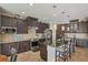 Modern kitchen featuring stainless steel appliances and a breakfast bar at 14527 Maysville Cir, Port Charlotte, FL 33981
