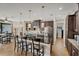 Well-equipped kitchen with dark wood cabinets and a large center island at 14527 Maysville Cir, Port Charlotte, FL 33981