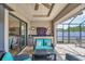 Outdoor lanai with grill, wet bar, mini fridge, lounge seating, and screened enclosure at 14527 Maysville Cir, Port Charlotte, FL 33981