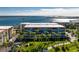 Waterfront condominium complex with meticulous landscaping and serene bay views from multiple balconies at 1551 Beach Rd # 412, Englewood, FL 34223