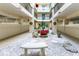 Beautiful atrium with sitting bench and seasonal decorations, creating a welcoming outdoor space at 1551 Beach Rd # 412, Englewood, FL 34223