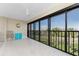 An enclosed balcony with tile floors and sliding glass doors providing plenty of natural light at 1551 Beach Rd # 412, Englewood, FL 34223