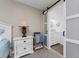 Main bedroom with en suite bath featuring double sinks and white cabinets at 1551 Beach Rd # 412, Englewood, FL 34223