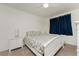 Inviting bedroom featuring carpet, a ceiling fan and ample natural light at 1551 Beach Rd # 412, Englewood, FL 34223