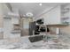 Well-lit kitchen featuring stainless steel appliances and neutral countertops at 1551 Beach Rd # 412, Englewood, FL 34223
