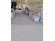 Bright living room featuring tile floors and neutral carpeting with cozy furniture and decor at 1551 Beach Rd # 412, Englewood, FL 34223
