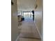 Inviting living room with neutral carpeting and large windows opening to the balcony with nice views at 1551 Beach Rd # 412, Englewood, FL 34223