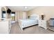 Serene main bedroom with plush carpeting, balcony access, and a television at 1551 Beach Rd # 412, Englewood, FL 34223