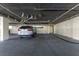 Spacious parking garage featuring assigned parking space and additional storage units at 1551 Beach Rd # 412, Englewood, FL 34223