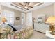Bedroom featuring tile flooring, a flamingo-patterned bedspread, and a window for natural lighting at 15588 Ruston Cir, Port Charlotte, FL 33981