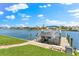 Private boat dock with lift, providing direct access to the tranquil waterway at 15588 Ruston Cir, Port Charlotte, FL 33981