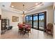 Charming dining room with a lake view, tile flooring, a chandelier, and comfortable seating for Gathering gatherings at 15588 Ruston Cir, Port Charlotte, FL 33981