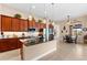 Beautiful kitchen featuring granite countertops, stainless steel appliances, tile flooring, and modern pendant lighting at 15588 Ruston Cir, Port Charlotte, FL 33981
