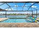 Relaxing pool area with comfortable lounge chairs and captivating water views at 15588 Ruston Cir, Port Charlotte, FL 33981