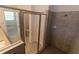 Bathroom with a glass enclosed shower, tile and a granite countertop vanity at 15968 Honeysuckle St, Port Charlotte, FL 33953