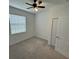 Comfortable bedroom with natural light, a ceiling fan and two closets for ample storage at 15968 Honeysuckle St, Port Charlotte, FL 33953