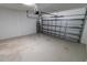 Empty two car garage with door partially open at 15968 Honeysuckle St, Port Charlotte, FL 33953