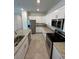 Well-equipped kitchen featuring stainless steel appliances and granite countertops at 15968 Honeysuckle St, Port Charlotte, FL 33953