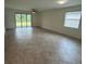 Bright living room featuring large windows, tile floors and access to the outdoors at 15968 Honeysuckle St, Port Charlotte, FL 33953