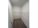 Walk-in closet equipped with shelving and carpeted floors offering a private storage solution at 15968 Honeysuckle St, Port Charlotte, FL 33953