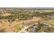 Expansive aerial shot showcasing a neighborhood near the water, with large properties and surrounding greenery at 16489 Trading Post Rd, Punta Gorda, FL 33955