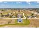 Aerial view of a modern home in a planned neighborhood with open space at 16489 Trading Post Rd, Punta Gorda, FL 33955
