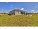 The home's backyard boasts a fenced pool, garden and lush grass at 16489 Trading Post Rd, Punta Gorda, FL 33955