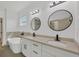 Luxurious bathroom with a freestanding tub, double vanity, and modern fixtures at 16489 Trading Post Rd, Punta Gorda, FL 33955