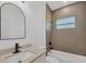 Bathroom with a modern mirror, vanity and tiled shower-tub combo at 16489 Trading Post Rd, Punta Gorda, FL 33955