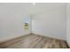 Bedroom with wood flooring and a window overlooking the neighborhood at 16489 Trading Post Rd, Punta Gorda, FL 33955