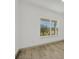 A light and airy bedroom with neutral decor and a window view at 16489 Trading Post Rd, Punta Gorda, FL 33955